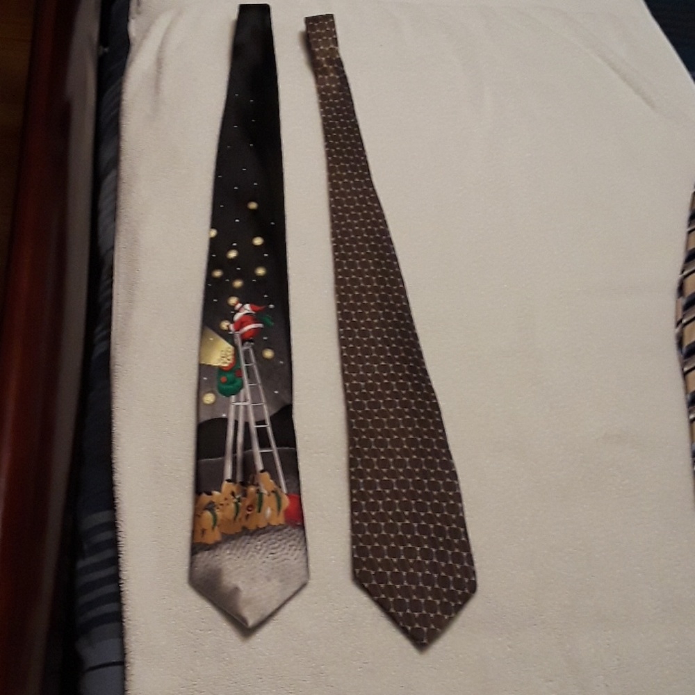 Two ties one is Van Heusen the other is Noel